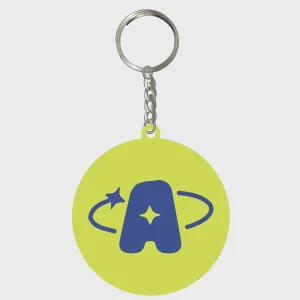 Anita Piss keyring, a lime disc with the blue 'A' star-and-orbit logo, on a metal split ring